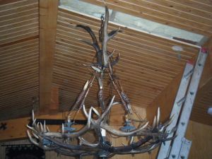 picture of chandelier initial hanging - click for larger image. Opens in new tab